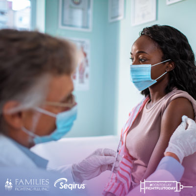 woman wearing face mask is vaccinated