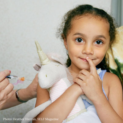child receiving flu shot